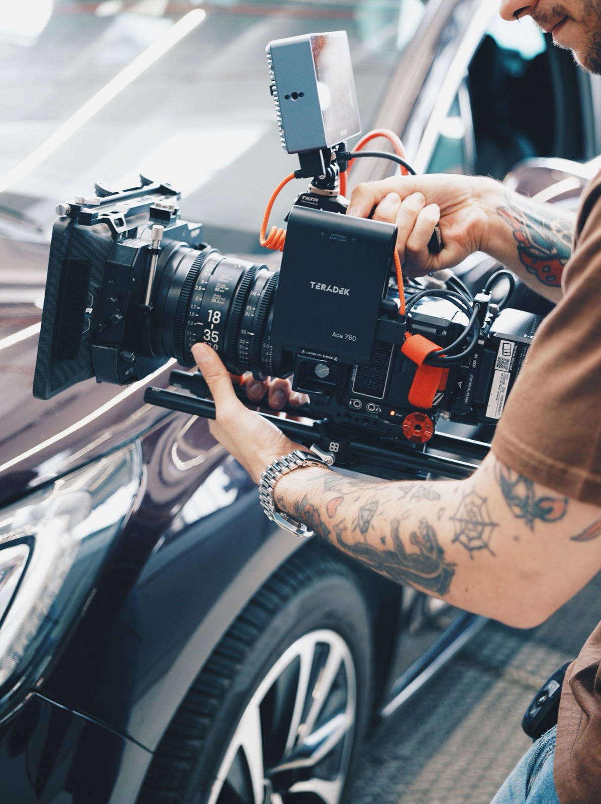 Nicolò Arduini on set, pulling focus on a cinema camera